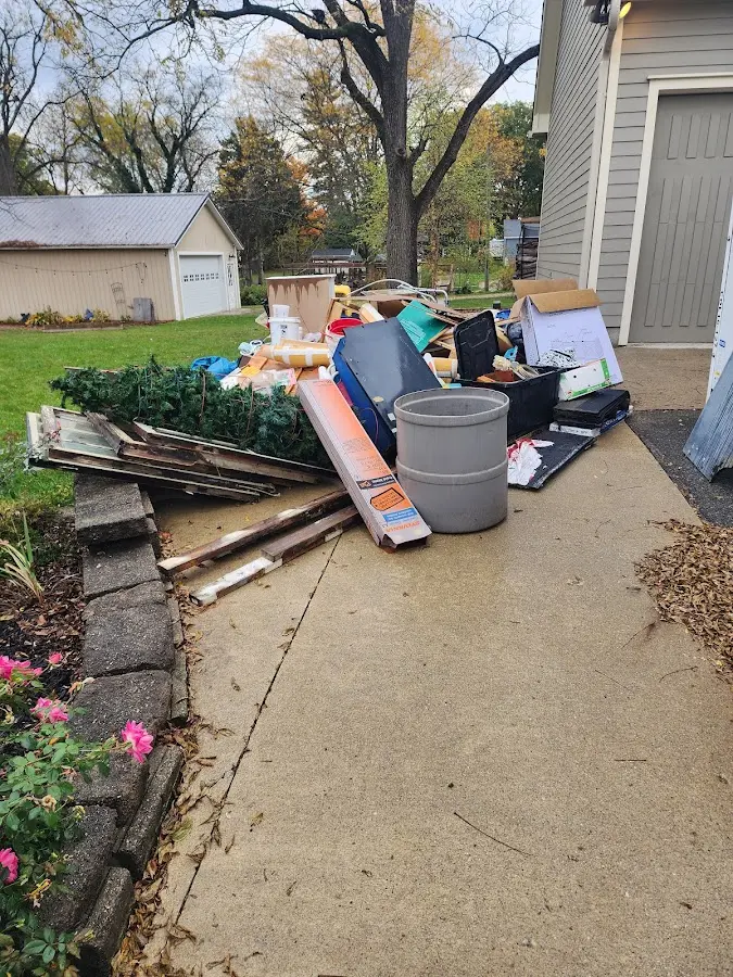 Dumpster being loaded with debris for 3 Yard Dumpster Rental in Chesterfield